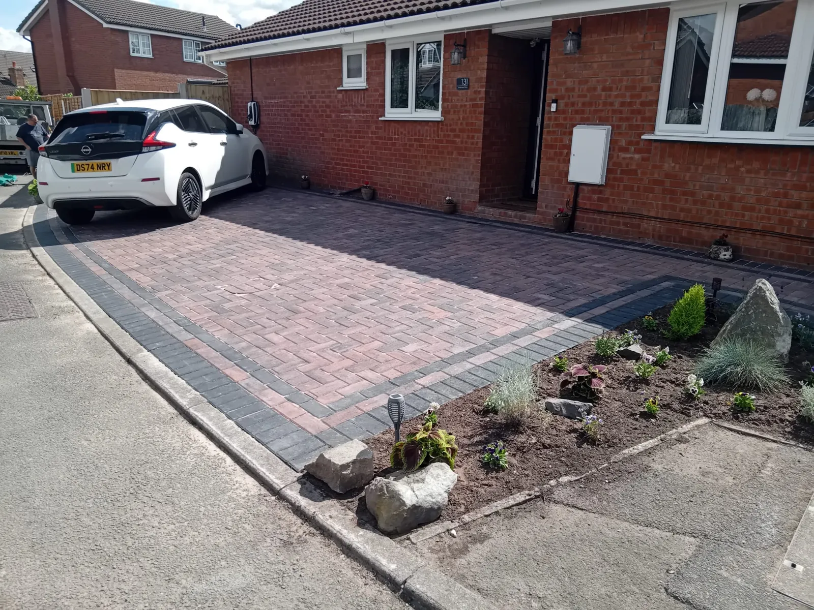 Block paving meeting a garden bed edge