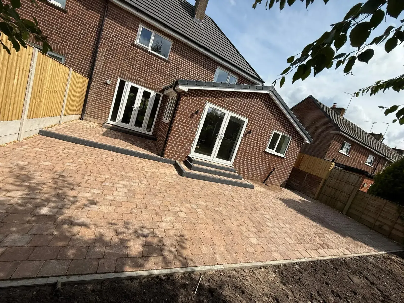 Patio laid outside a rear extension