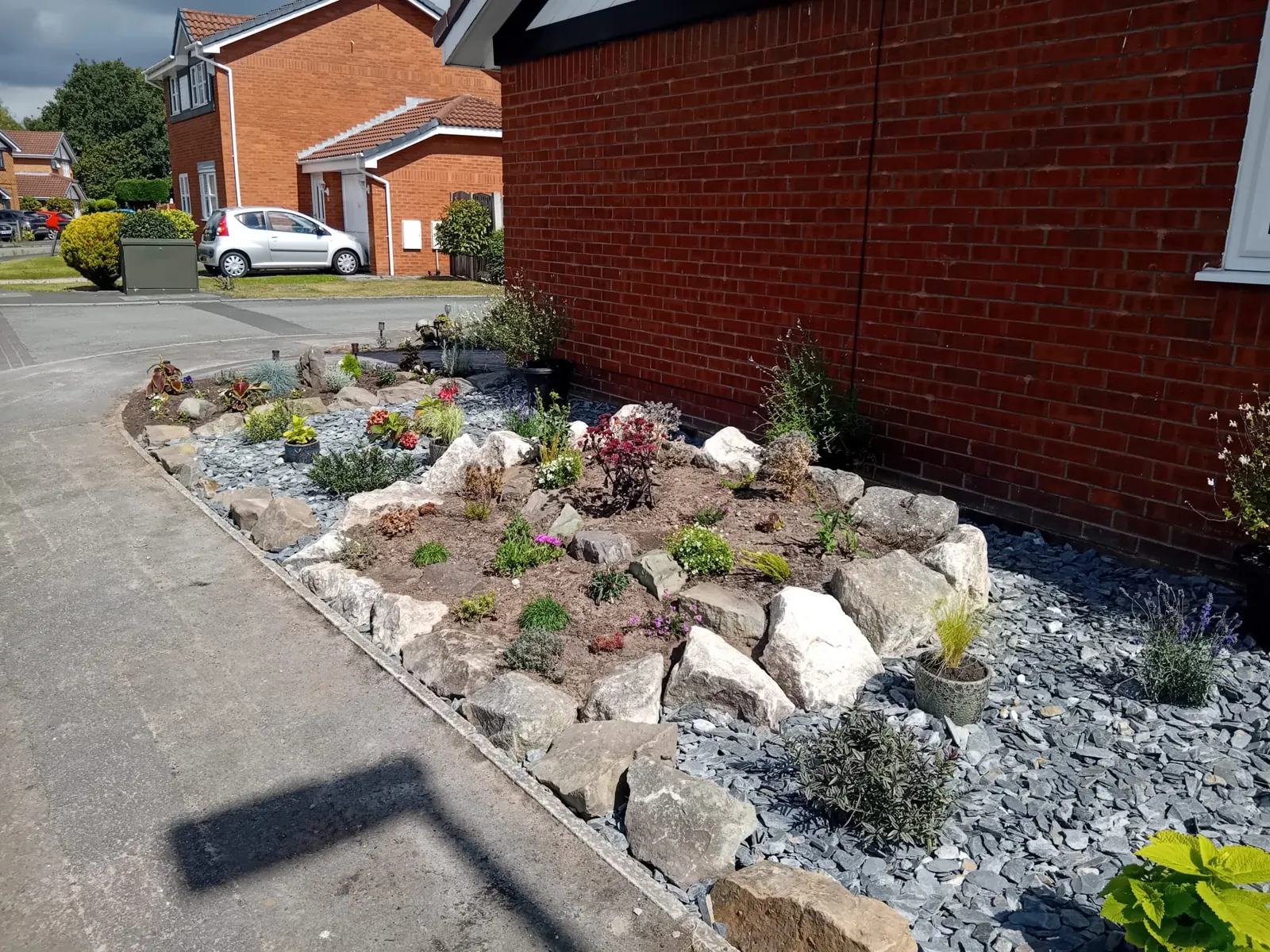 Front garden rockery with stone and planting