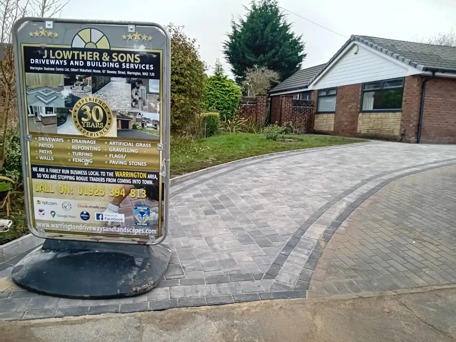Driveway job in progress with the J Lowther site board